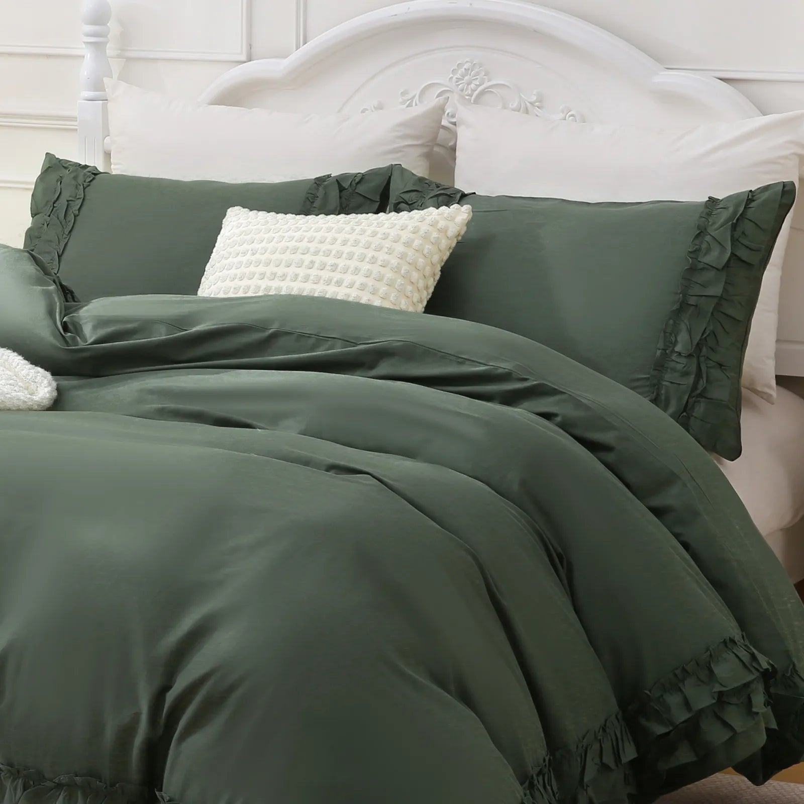 Close-up shot of the ruffled edge on the corner of the green comforter set