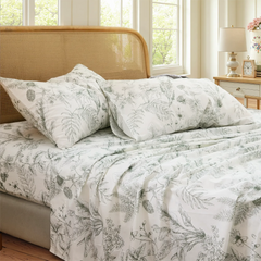 Close up detail of cotton greenery botanical print pillowcases and fitted sheet set