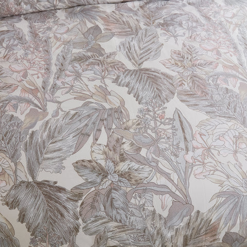 Close-up shot of the comforter's grey leaves pattern and fabric texture