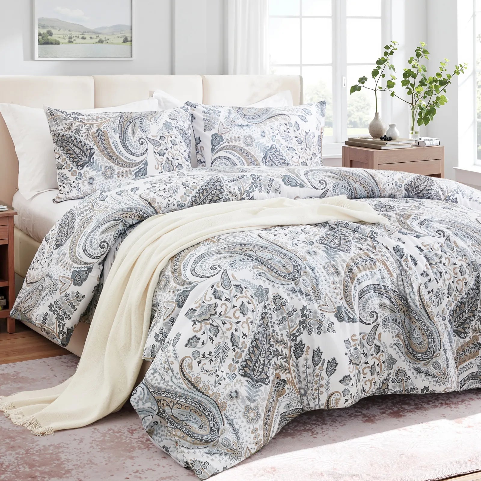 Close-up shot of the detailed grey paisley pattern on the duvet cover