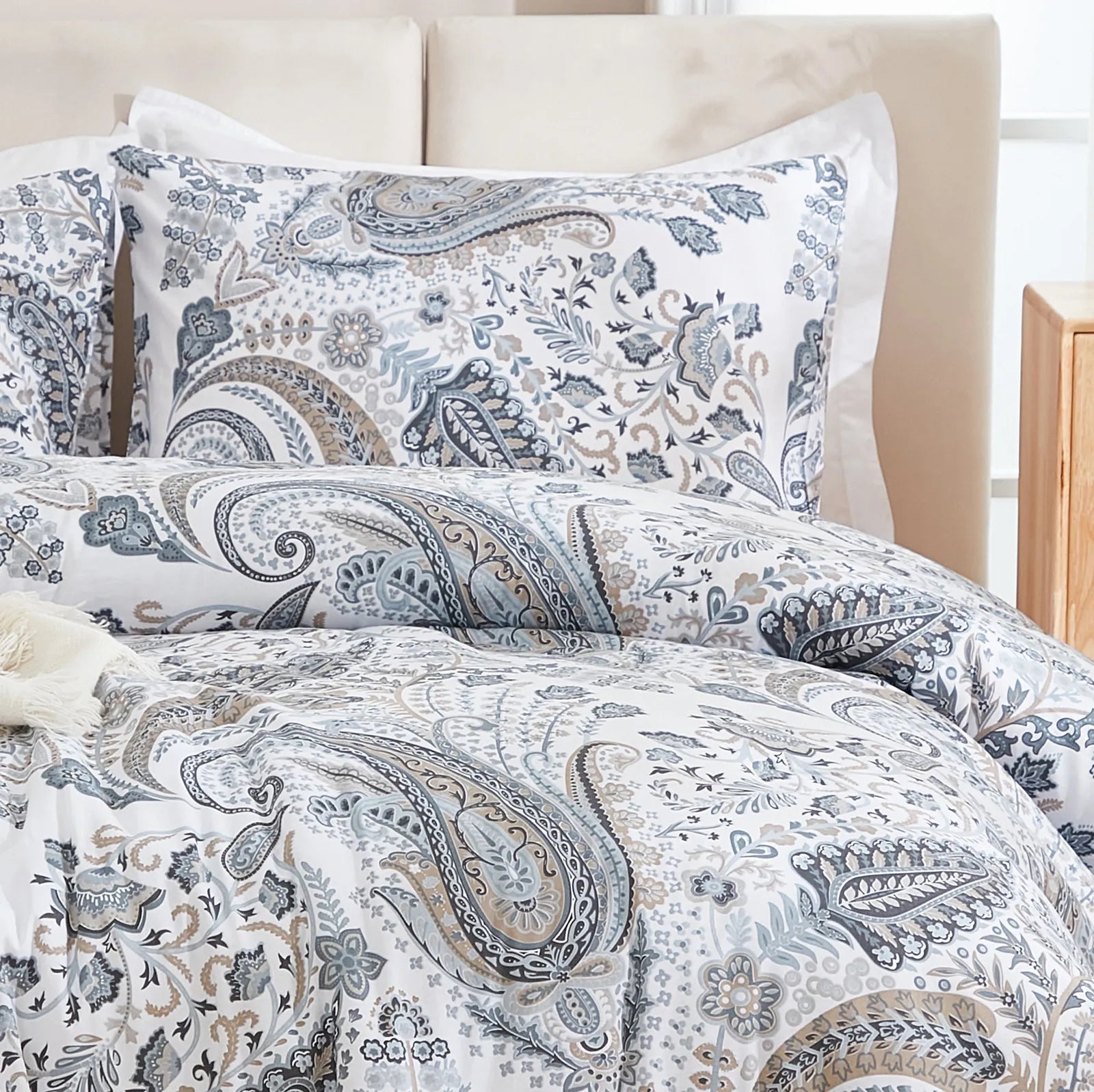 A detailed view of the 100% cotton fabric and intricate paisley design