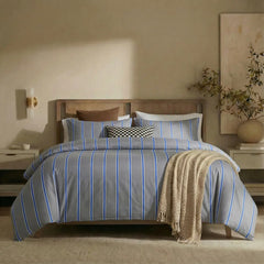 Full front view of grey blue striped bedding set