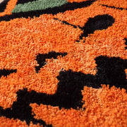 happy haunting rug jack o lantern orange black plush texture close up