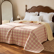 haven plaid yarn dyed quilt blush haven dark wooden headboard arched mirror