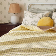 haven stripe yarn dyed quilt set pale lemon stripe green floral pillows nightstand