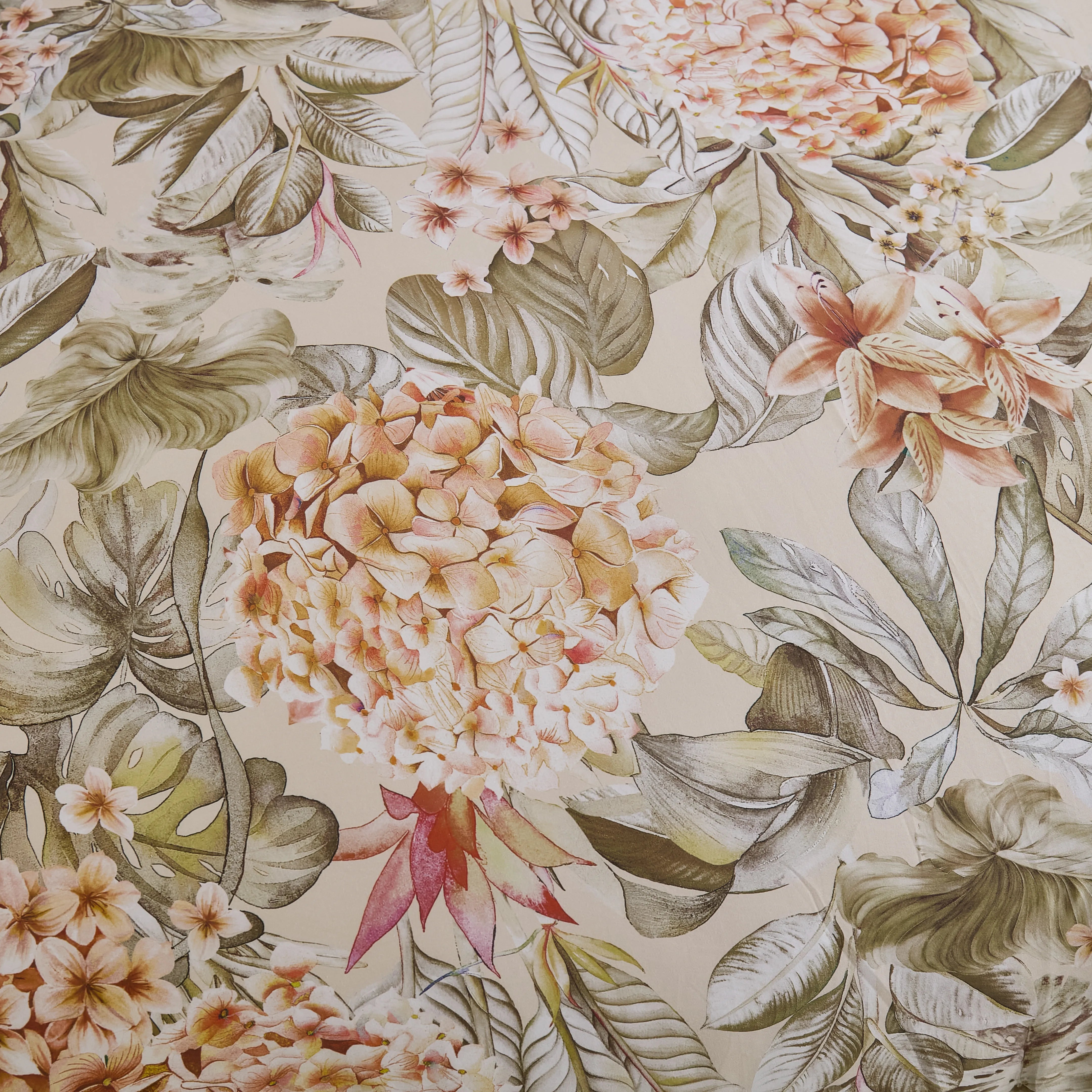 Detailed view of the yellow, red and green floral pattern on the comforter