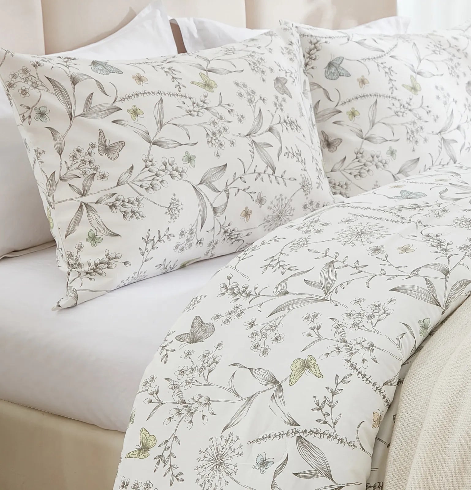 Close-up shot of the vintage grey floral pattern on the duvet cover