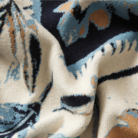 A detailed shot of theleaf pattern fleece blanket, showcasing the plush soft fabric texture.
