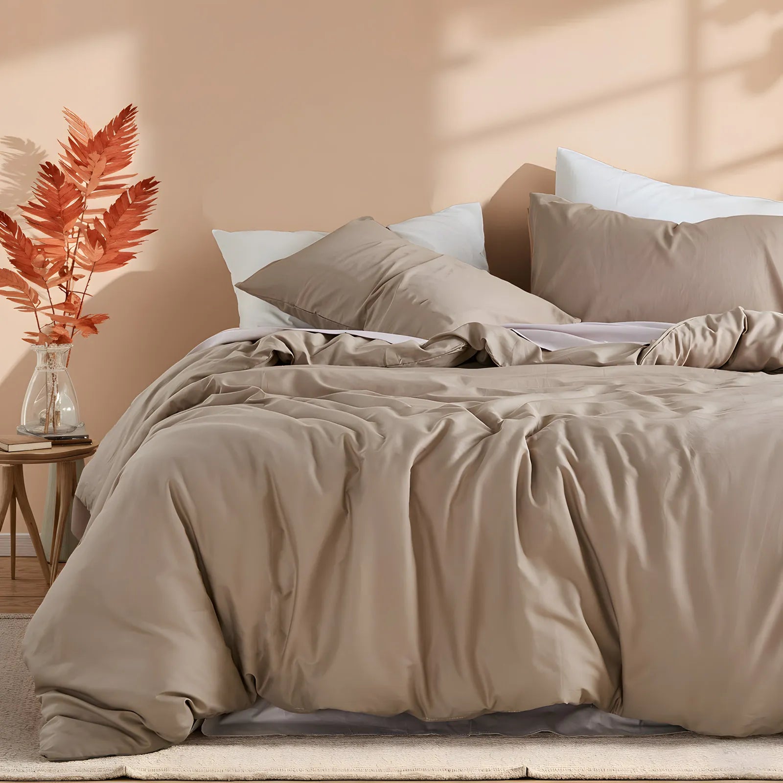 Side view of light brown duvet with pillow arrangement
