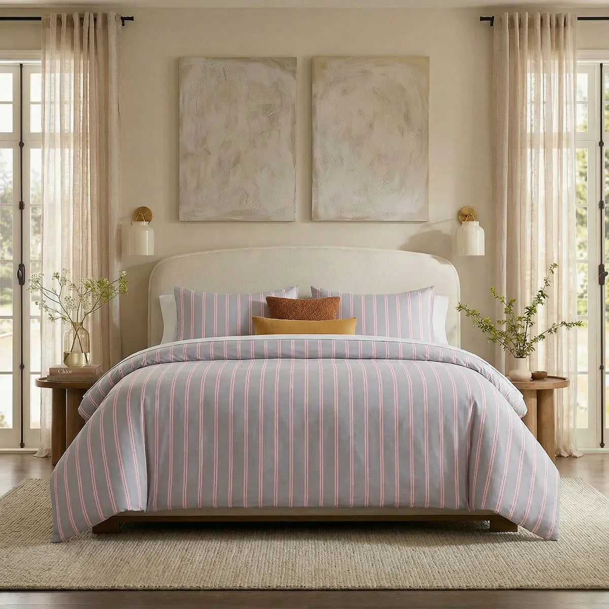Full front view of light grey and pink  striped bedding set