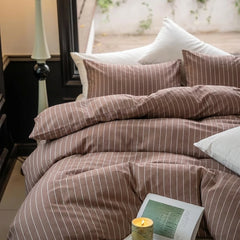 luxury pinstripe brown cotton duvet cover with pillows and candle