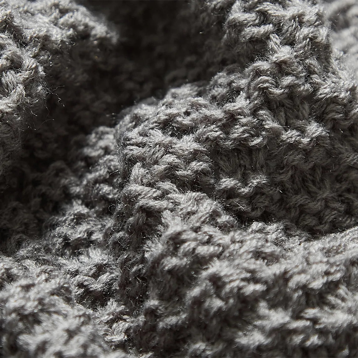 Macro Close-up of Grey Knitted Fabric Texture and Detail