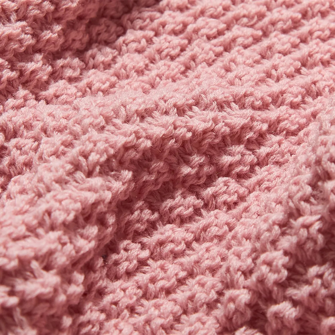 Macro Close-up of Pink Knitted Fabric Texture and Weave
