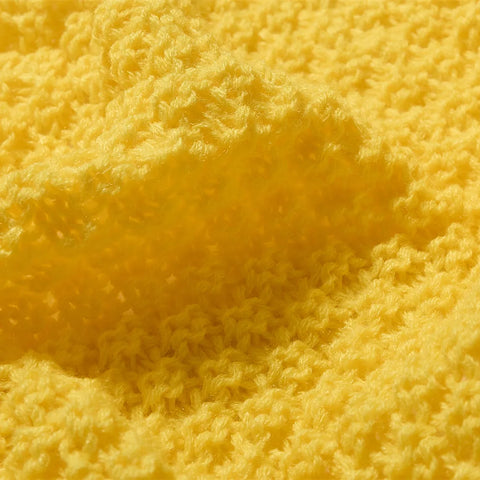 Macro Close-up of Sunny Yellow Knitted Fabric Texture and Weave