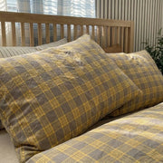 matching slate grey plaid pillow shams ochre bedding detail