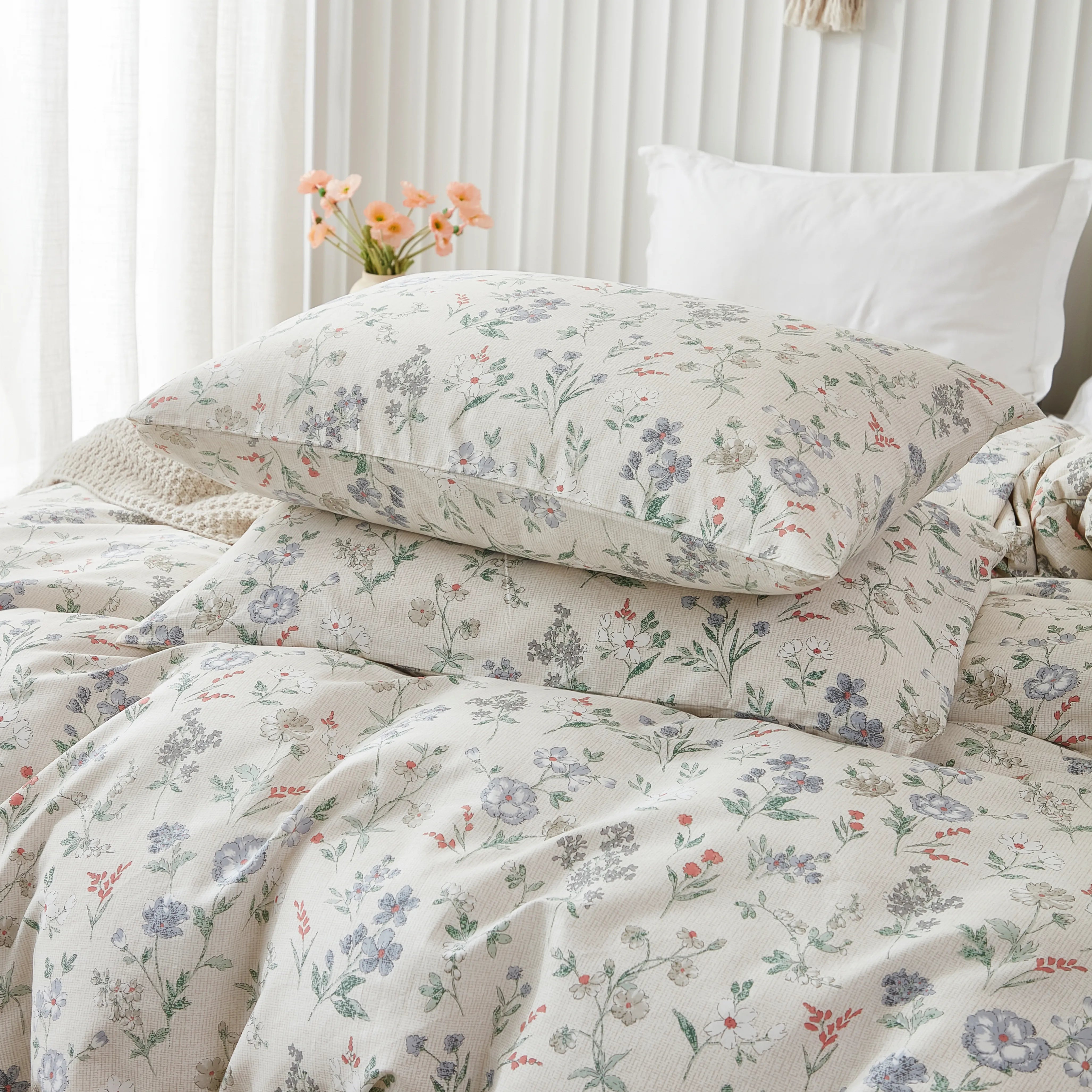 Close-up of the matching floral pillows from the comforter set