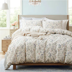 The meadow floral duvet cover set styled in a cozy, bright bedroom