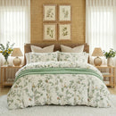 meadow sage bloom duvet cover set styled on bed in light green cottagecore bedroom