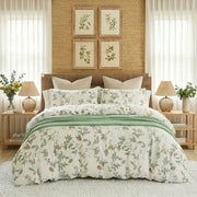 meadow sage bloom duvet cover set styled on bed in light green cottagecore bedroom