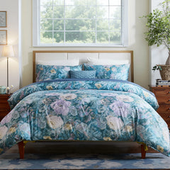 Front view of the midnight blue floral garden comforter set on a bed in a classic bedroom. 