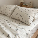 minimalist meadow sprig pillowcases and sheets close up