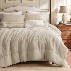 Natural linen pillowcases styled on a bed with beige bedding