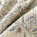 orchard flora washed cotton linen quilt slate blue botanical olive leaf print close up