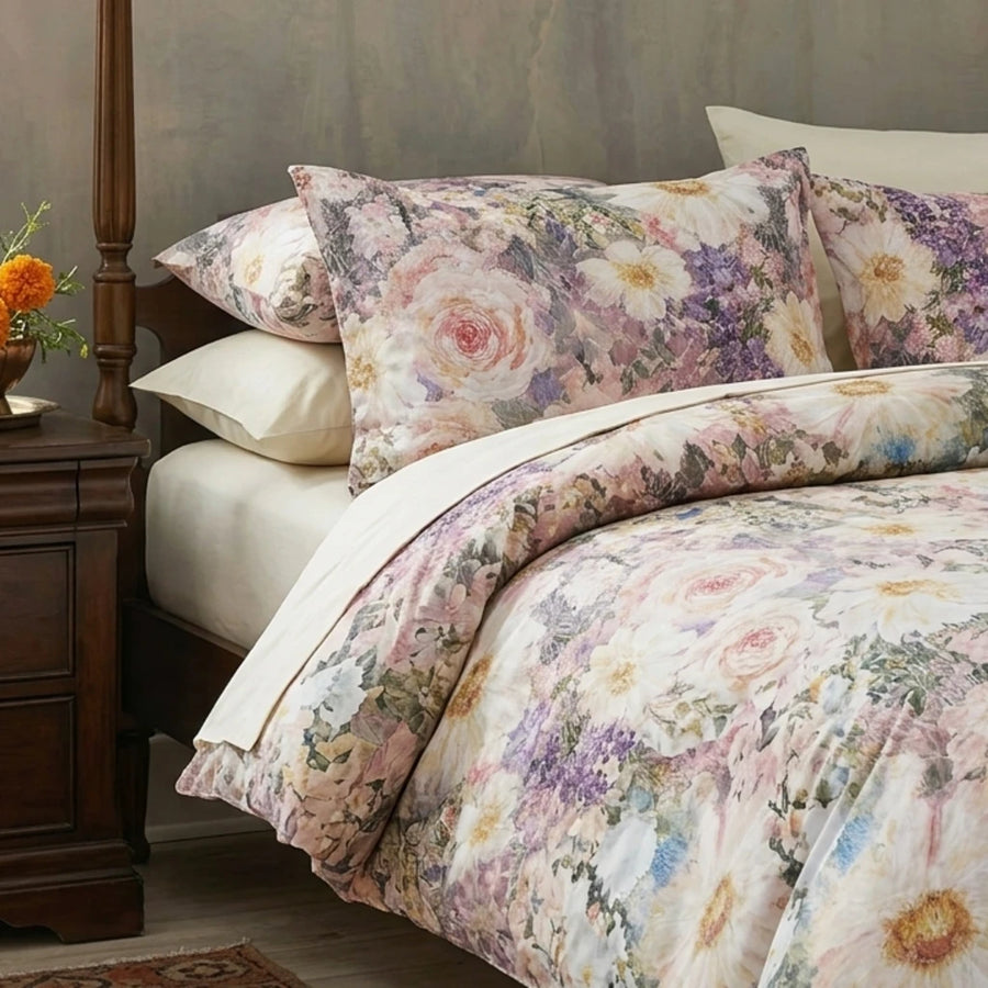painterly moody garden duvet cover with brass headboard and vintage landscape wall art