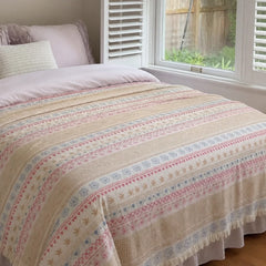 pastel folk woven cotton throw blanket bed setup