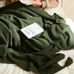 Close-up of Person Using Moss Green Knitted Throw Blanket Reading