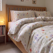 petal reverie floral duvet cover set cream pastel wildflower wooden bed lamp