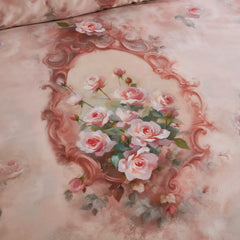 Detailed view of the vintage rose and frame pattern on the comforter
