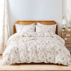 Full view of the pink floral duvet cover set styled on a bed