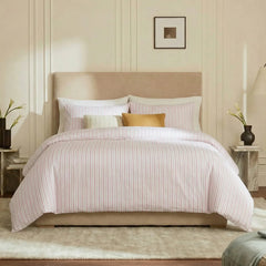 Full front view of pink and white  striped bedding set
