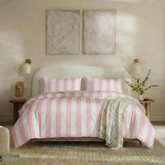 Full front view of pink and white striped bedding set