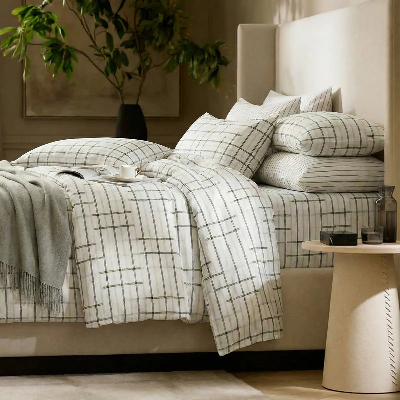 Side view of plaid comforter set in bedroom
