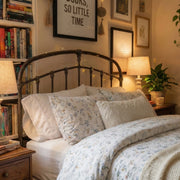 poetic meadow wildflower duvet cover set styled in a cozy bedroom with a full bookcase and fairy lights