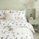 premium cotton butterfly quilt cover with puffy cushion detail styled in bright bedroom