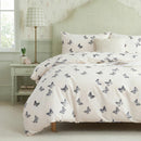 shabby chic butterfly print bedding set in cottagecore aesthetic bedroom with light green walls