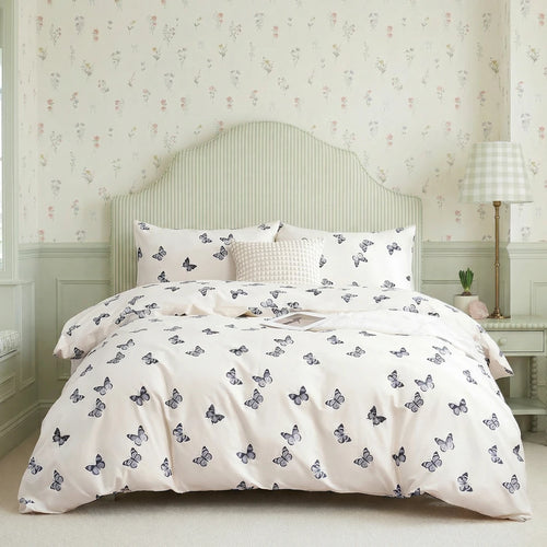 vintage provence butterfly flight duvet cover set styled on bed sage green striped headboard french country bedroom