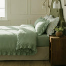 pure serenity sage green bedding side view sunlight