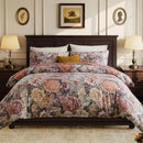 renaissance rose bloom duvet cover set styled on a dark wood bed with vintage lamps and warm lighting