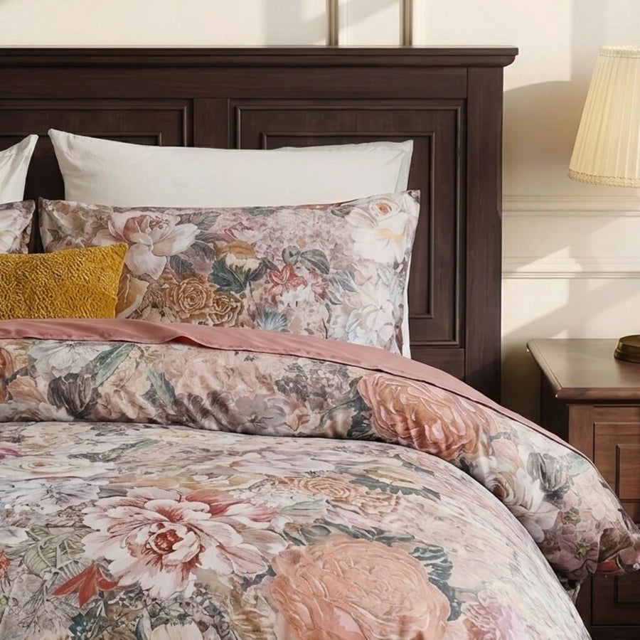 detailed view of oil-painting style floral print on cotton pillows and duvet cover