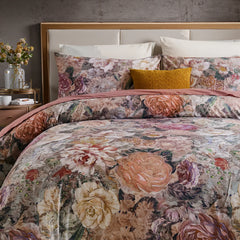 Retro floral cotton duvet cover set fully displayed on bed with pink purple blooms