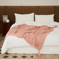 Rose Pink Throw Blanket Draped on Bed Showing Cable Knit Pattern