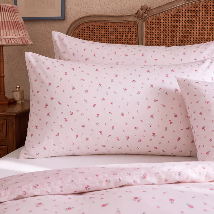 rosewick garden floral pillowcases blush pink botanical print rattan bedroom closeup