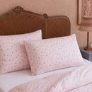 rosewick garden floral pillowcases blush pink vintage rattan bedroom overview