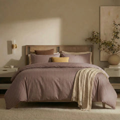 Full front view of rust red striped bedding set