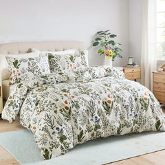 The sage green botanical bedding set styled in a bright, coastal bedroom