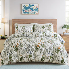 The sage green floral duvet cover set on a bed, showing the full design